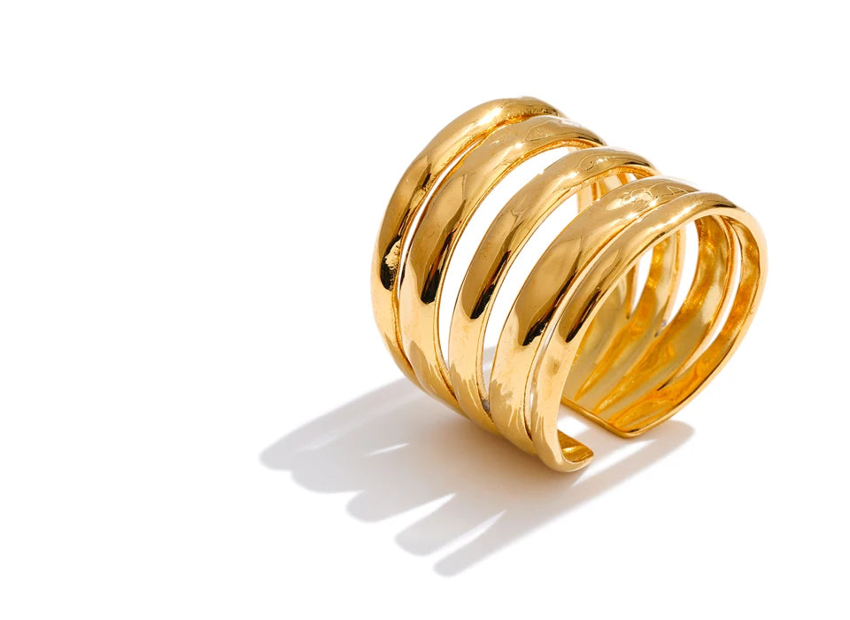 Geometric layered ring in 18K gold-plated stainless steel.
