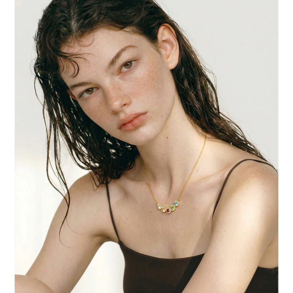 Cubic zirconia multi-color geometric necklace in gold-plated stainless steel with cubic zirconia.
