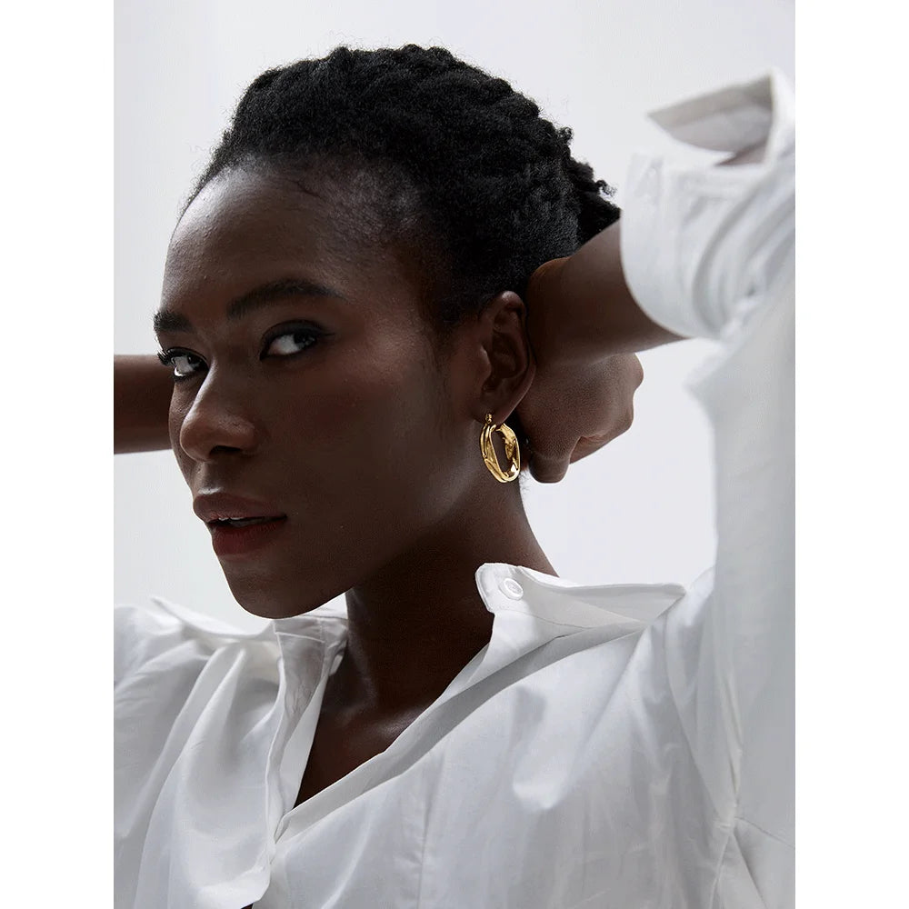 Geometric earrings in gold-plated 316L stainless steel.