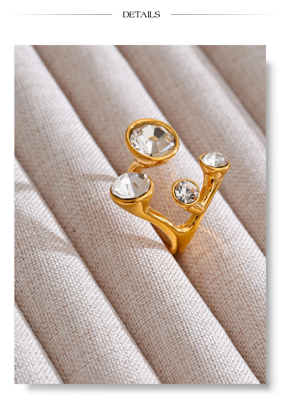Crystal geometric ring in 18K gold-plated stainless steel with crystal.