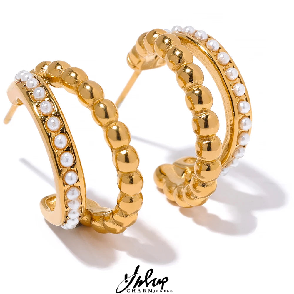 Gold-plated stainless steel earrings with pearls.