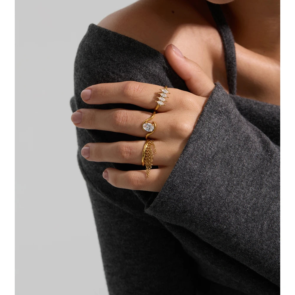 Cubic zirconia geometric ring in 18K gold-plated stainless steel with cubic zirconia.