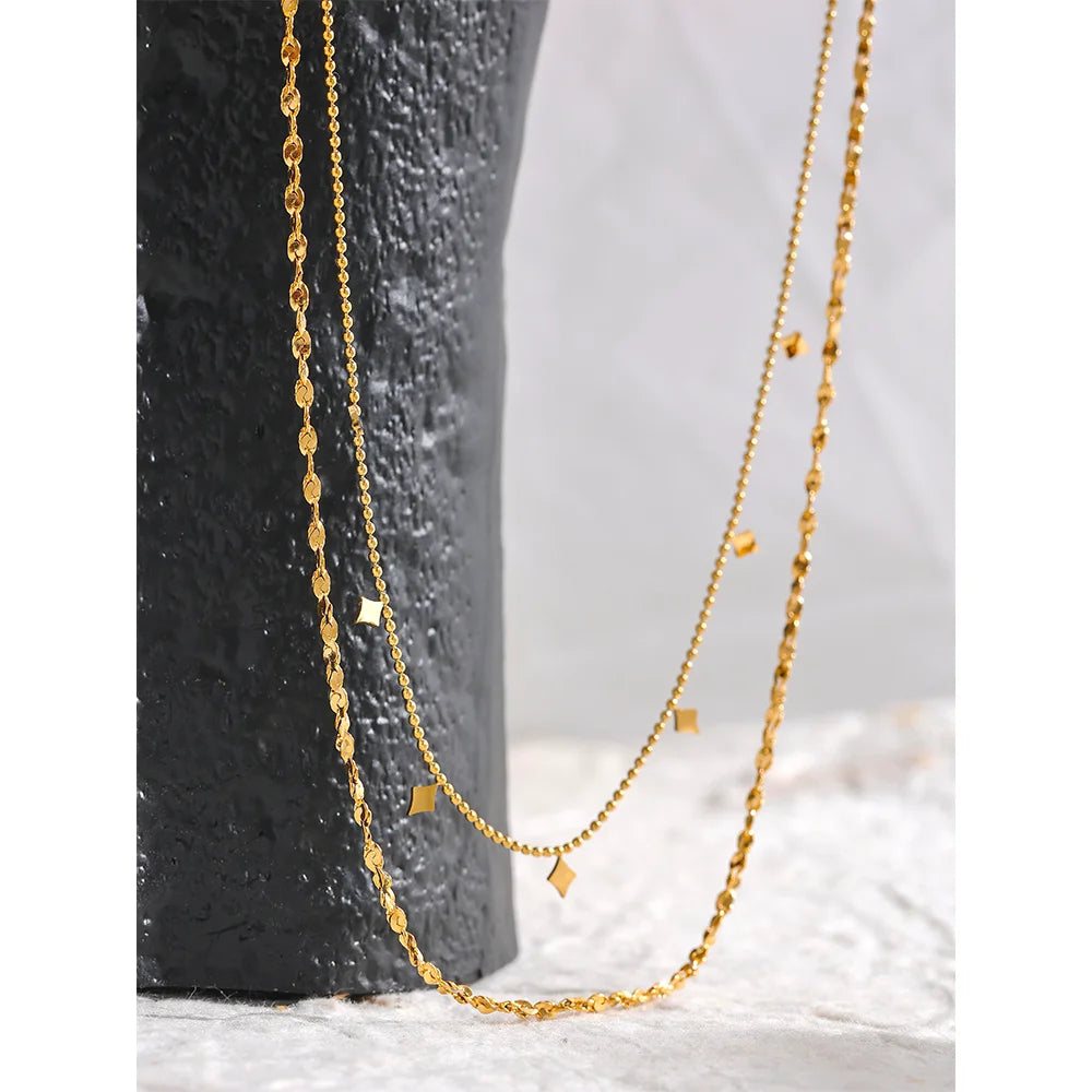 Geometric chain layered necklace in gold-plated stainless steel.