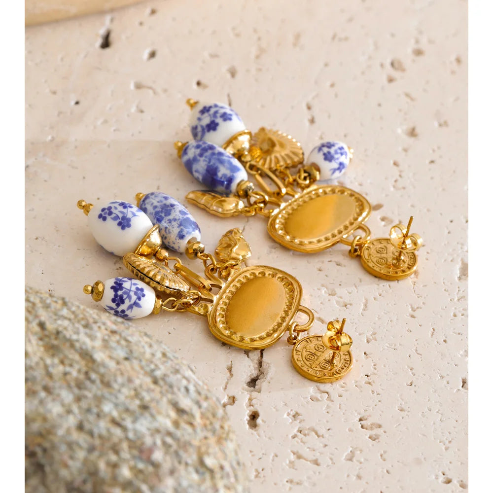 Blue heart flower earrings in gold-plated stainless steel.