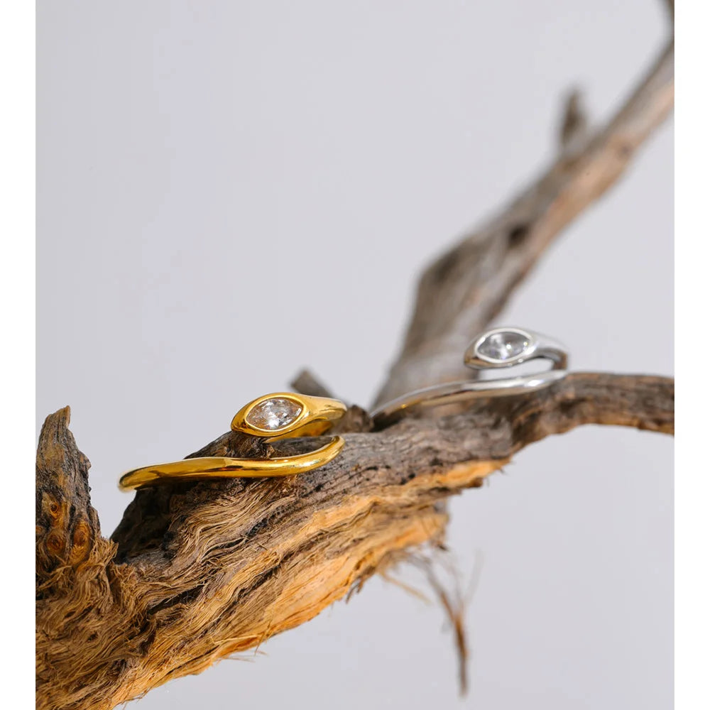 Cubic zirconia snake geometric ring in 18K gold-plated stainless steel with cubic zirconia.