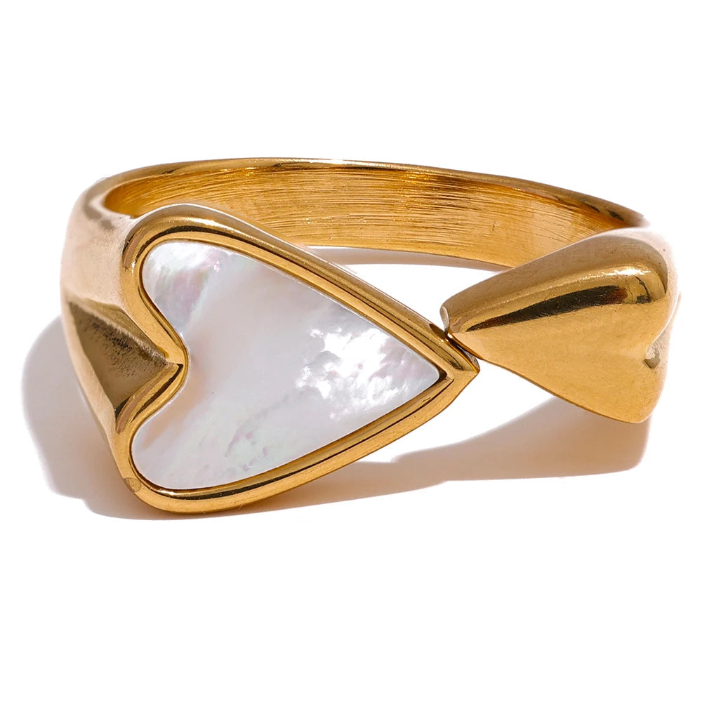 Gold-plated stainless steel ring with shell and acrylic design.