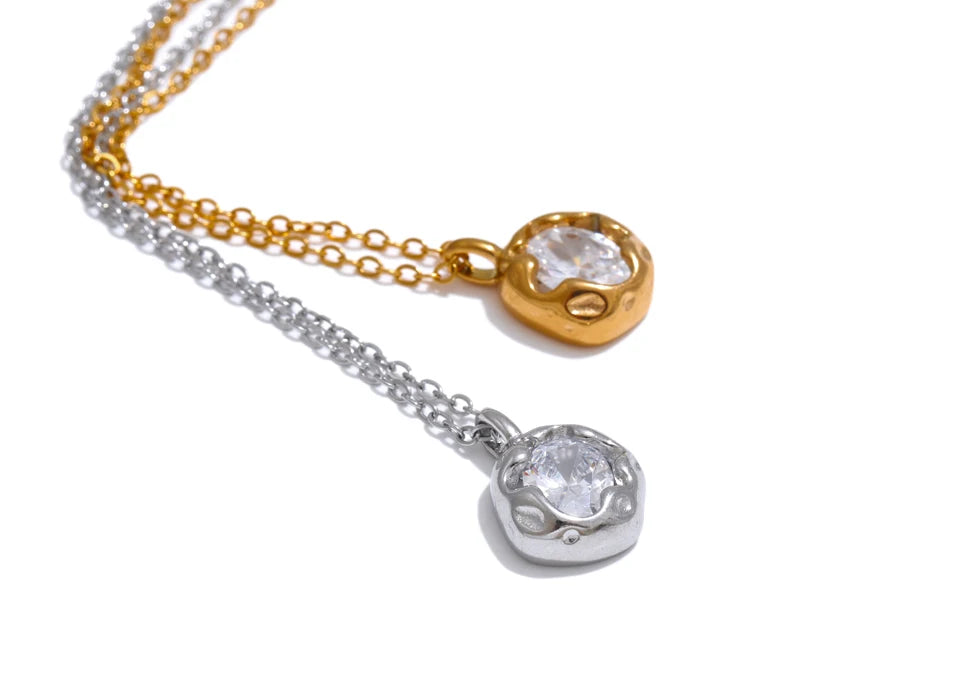 Cubic zirconia geometric necklace in gold-plated stainless steel with cubic zirconia.