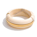 Resin acrylic geometric bracelet in gold-plated stainless steel with resin and acrylic.