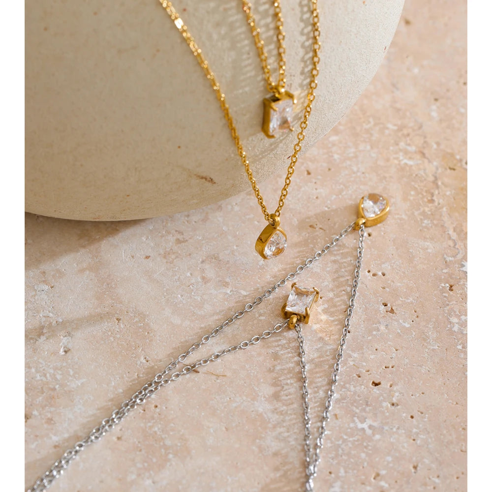 Cubic zirconia geometric layered necklace in gold-plated stainless steel with cubic zirconia.