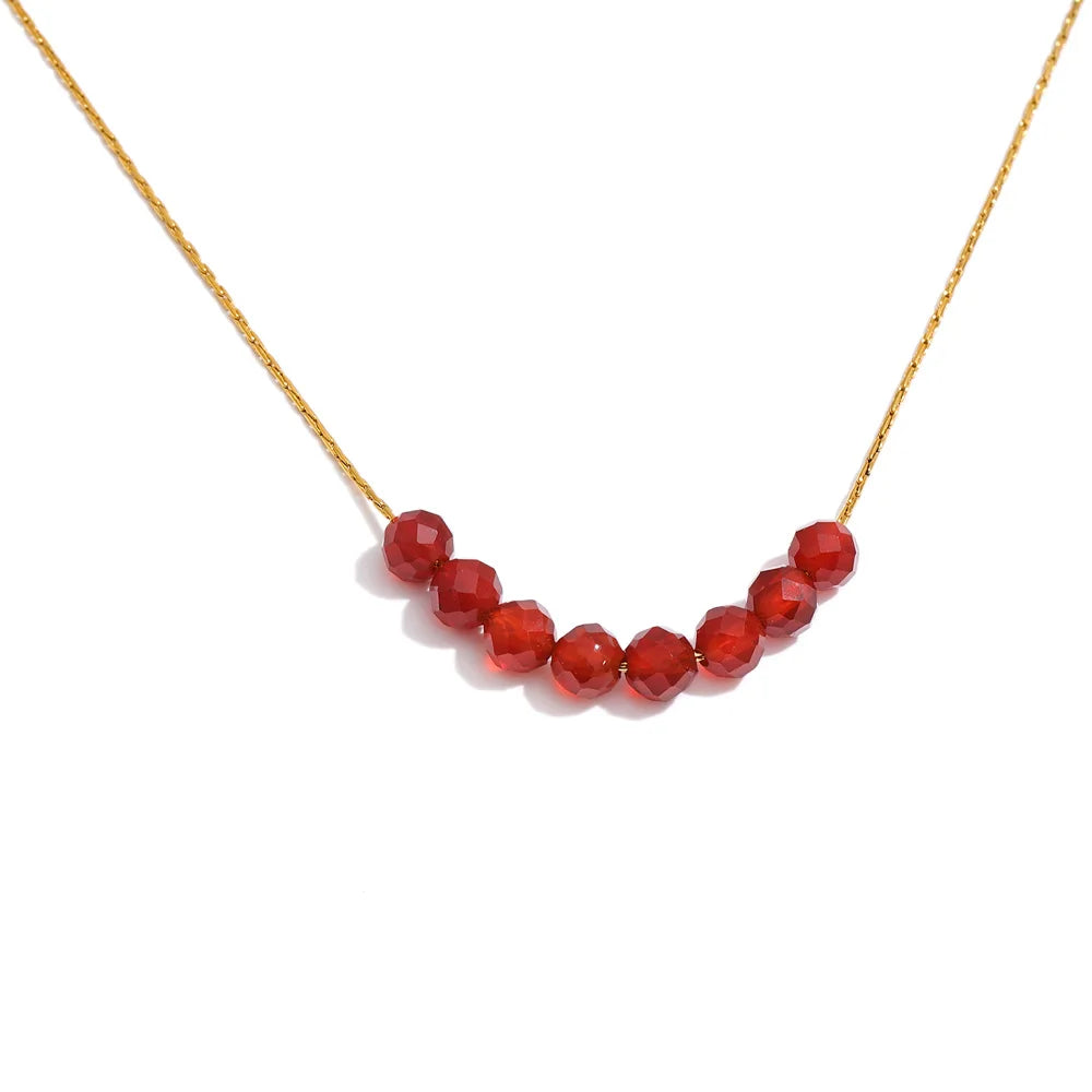 Natural stone beaded geometric necklace in gold-plated stainless steel with natural stone.