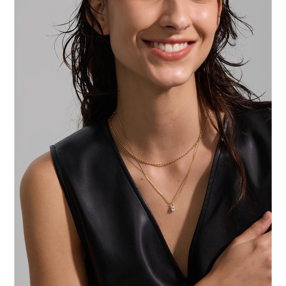 Cubic zirconia geometric layered necklace in gold-plated stainless steel with cubic zirconia.