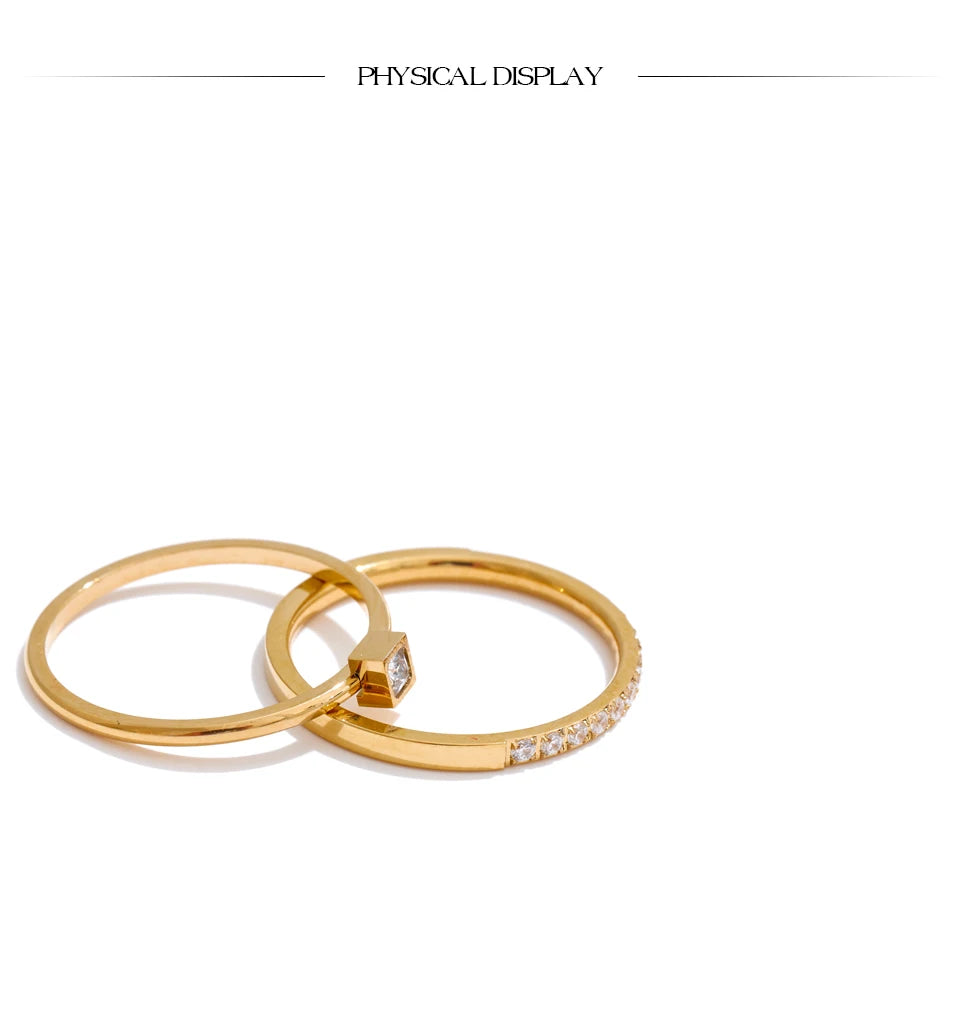 Cubic zirconia geometric ring in 18K gold-plated stainless steel with cubic zirconia.