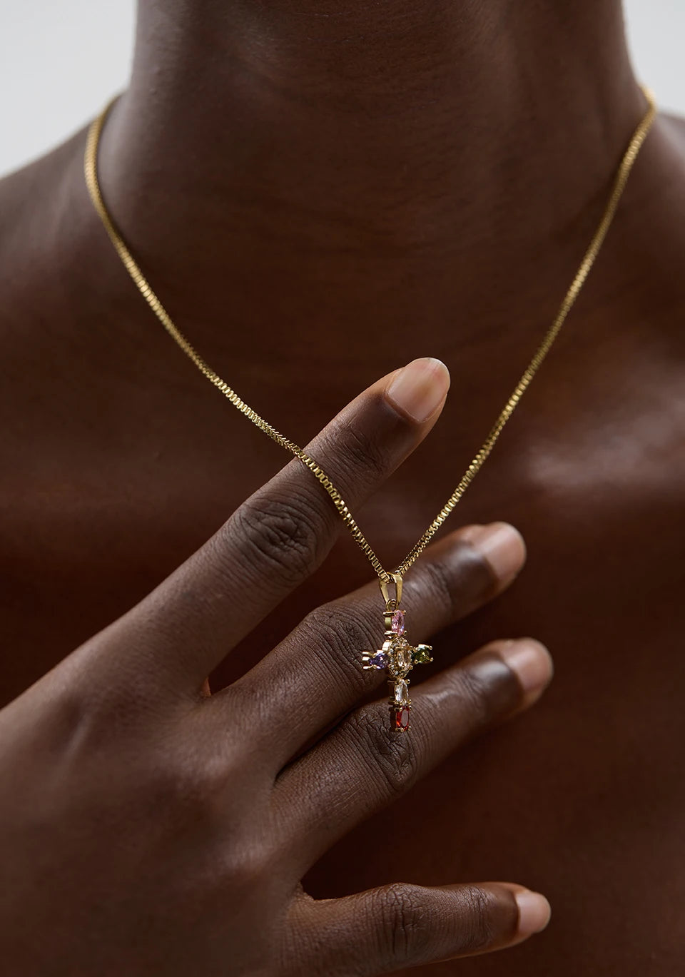 Cubic zirconia cross multi-color necklace in gold-plated stainless steel with cubic zirconia.