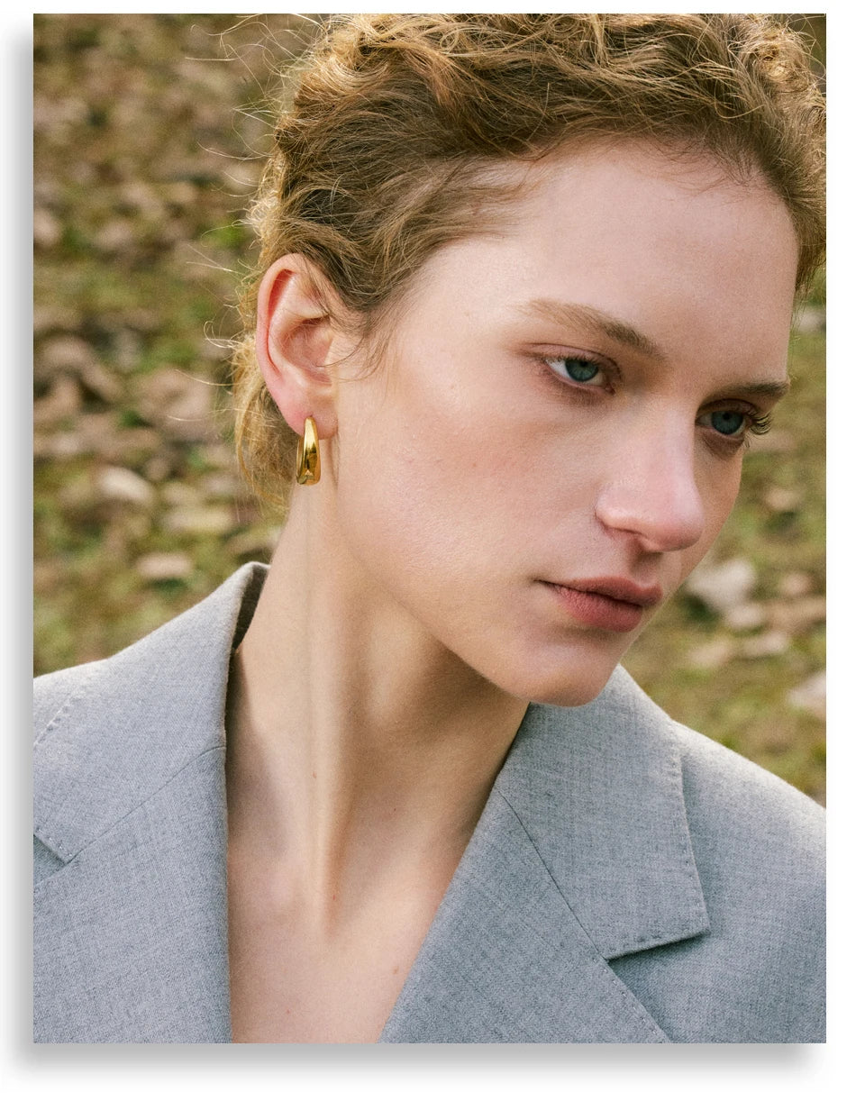 Geometric earrings in gold-plated 316L stainless steel.