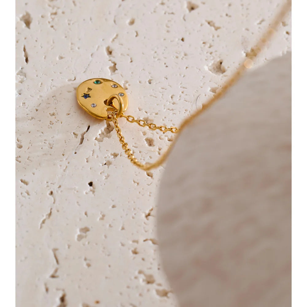 Cubic zirconia multi-color geometric necklace in gold-plated stainless steel with cubic zirconia.