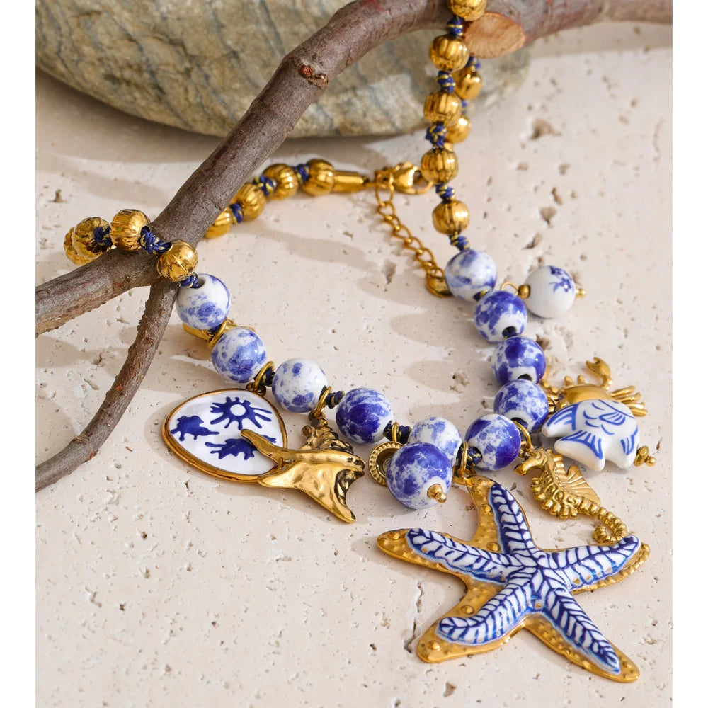 Star beaded geometric necklace in gold-plated stainless steel.