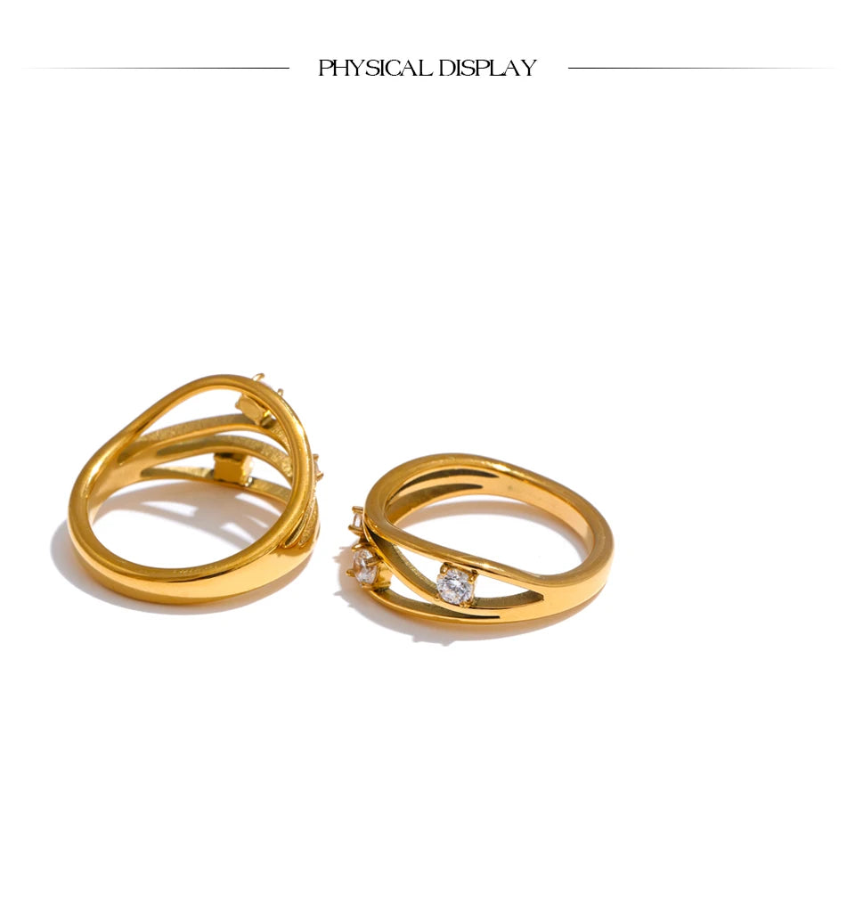 Cubic zirconia geometric ring in 18K gold-plated stainless steel with cubic zirconia.