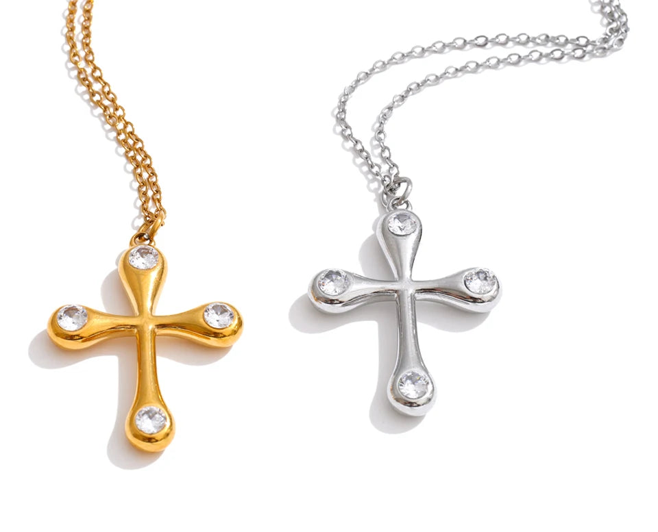 Cubic zirconia cross necklace in gold-plated stainless steel with cubic zirconia.