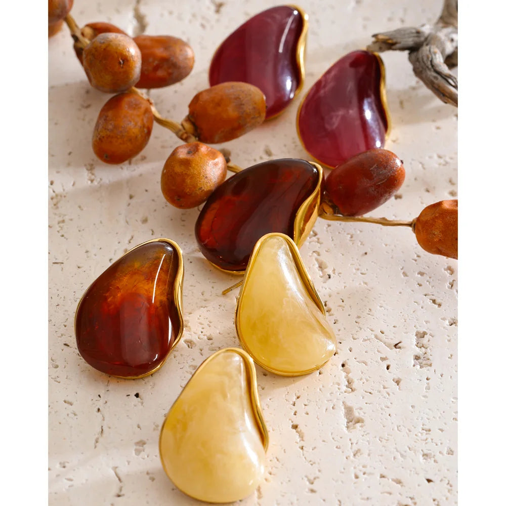 Red resin acrylic earrings in gold-plated stainless steel with resin and acrylic.