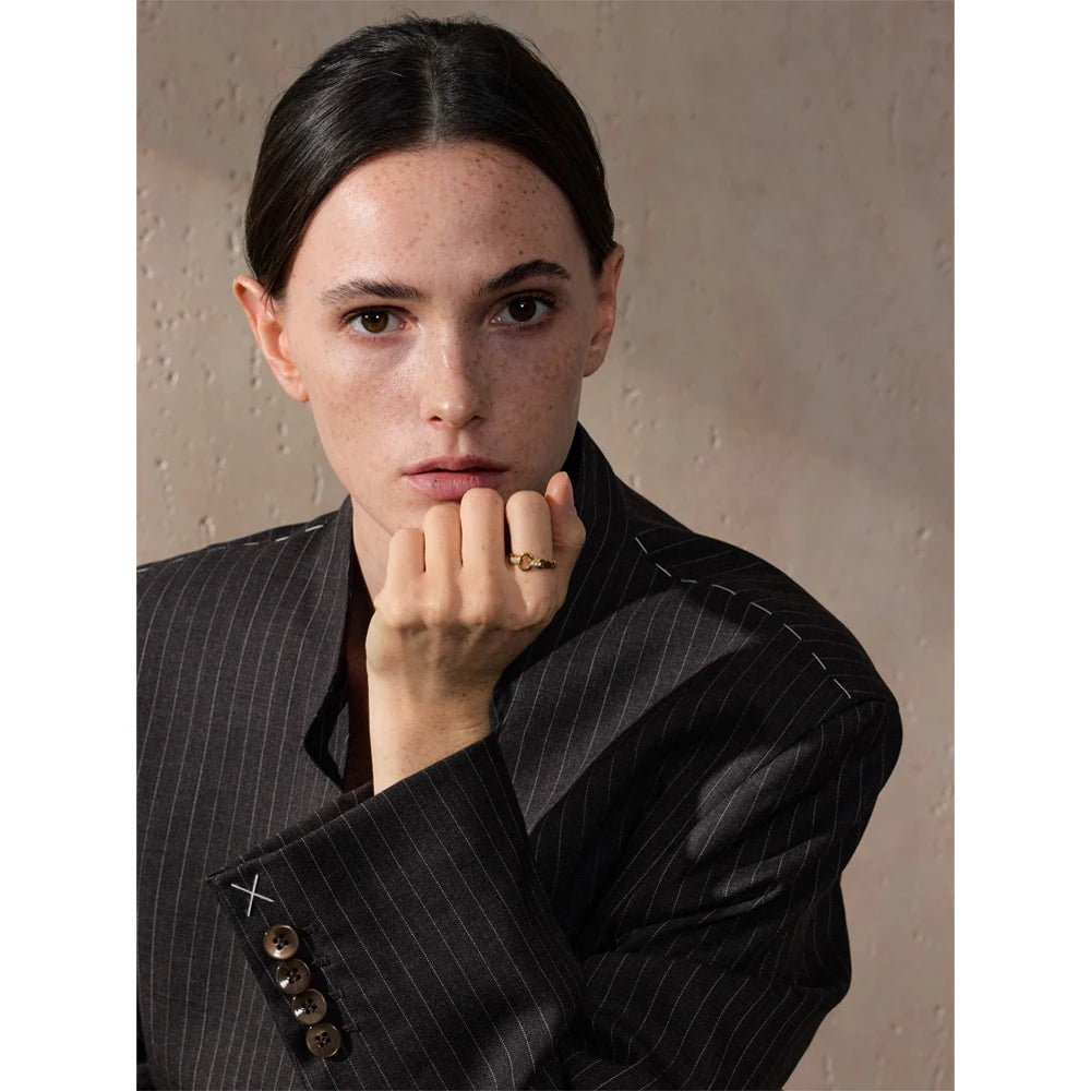 Cubic zirconia geometric ring in gold-plated stainless steel with cubic zirconia.
