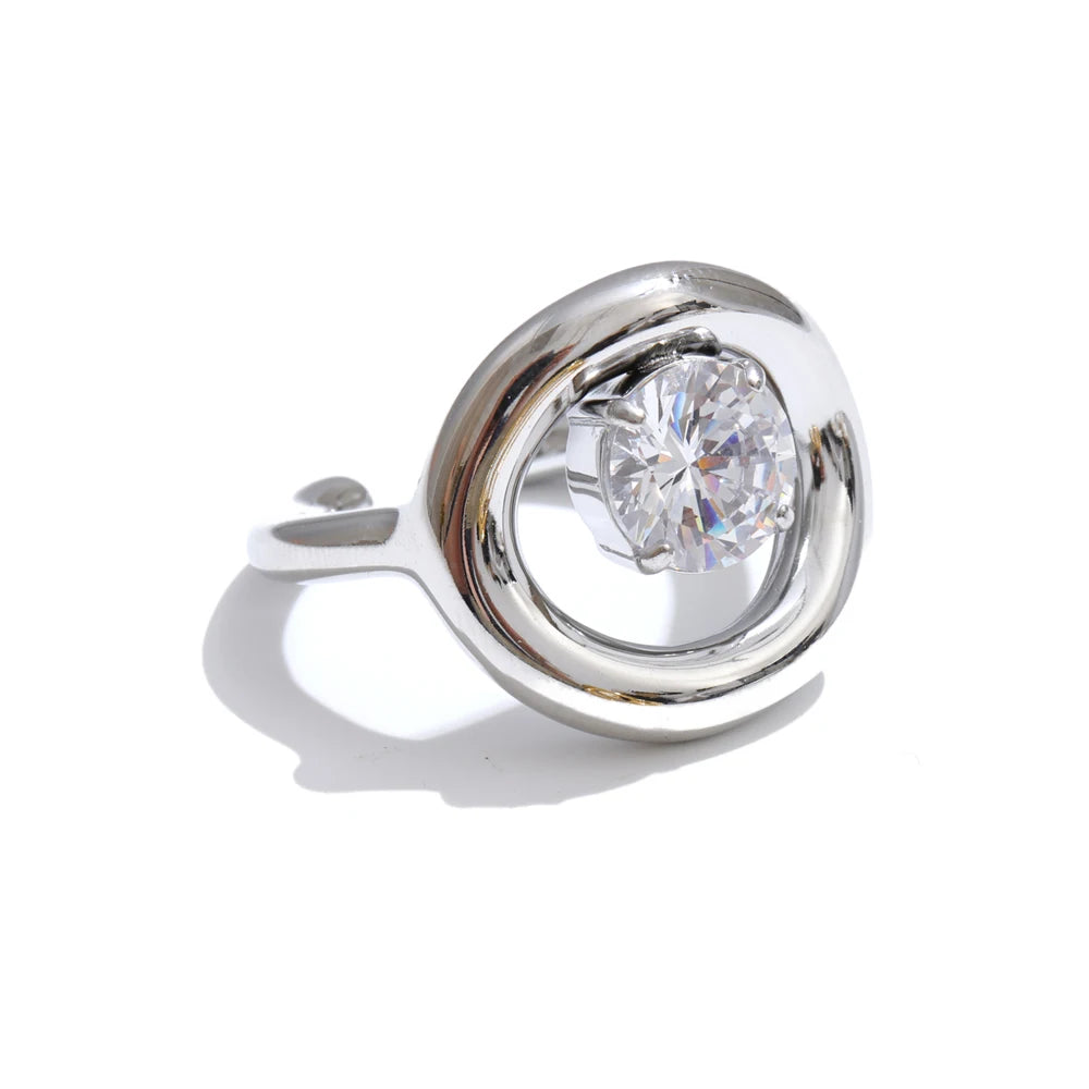 Cubic zirconia geometric ring in 18K gold-plated stainless steel with cubic zirconia.