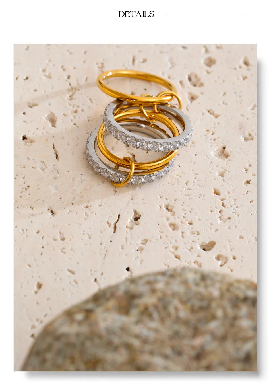 Cubic zirconia geometric layered ring in 18K gold-plated stainless steel with cubic zirconia.