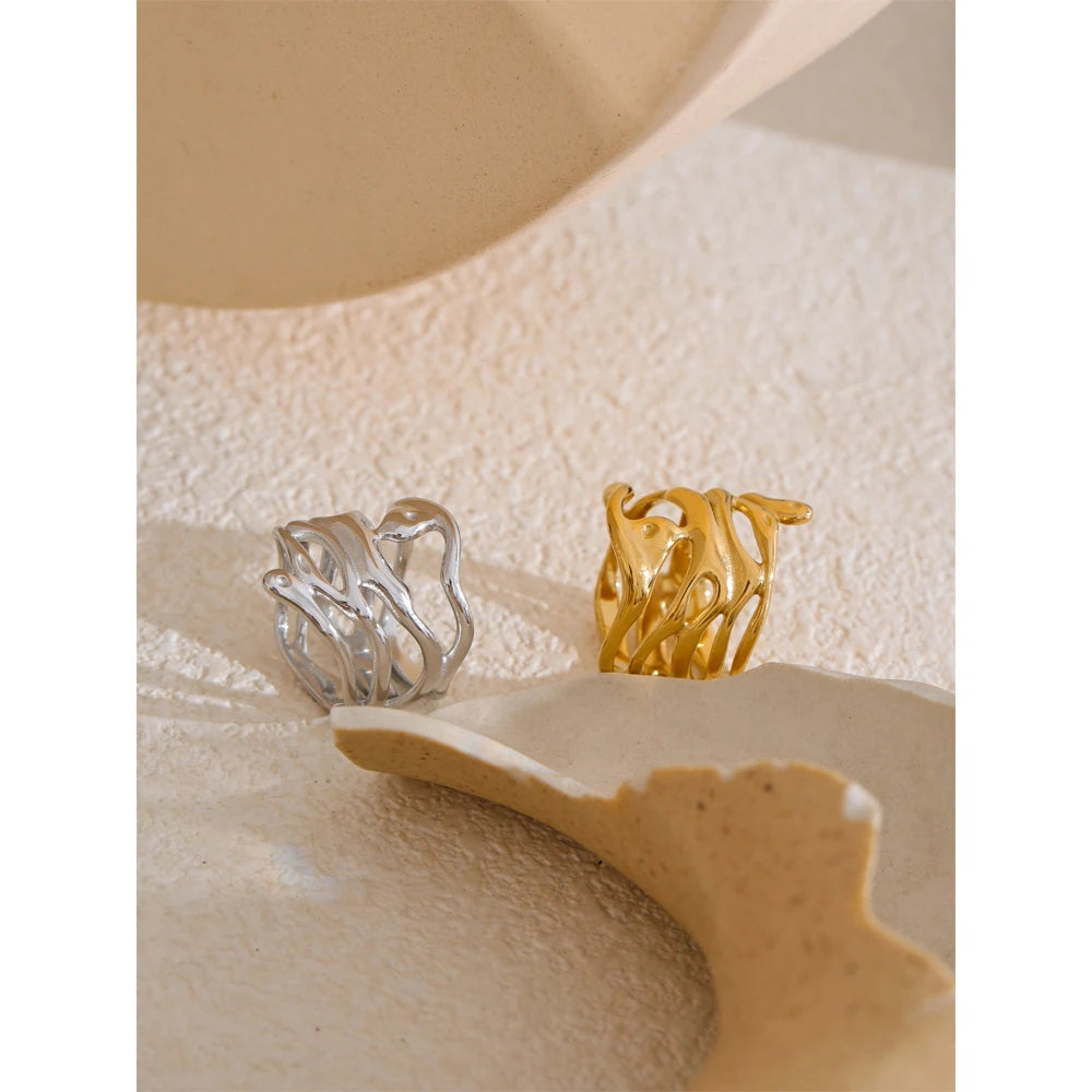 Geometric layered ring in gold-plated 316L stainless steel.