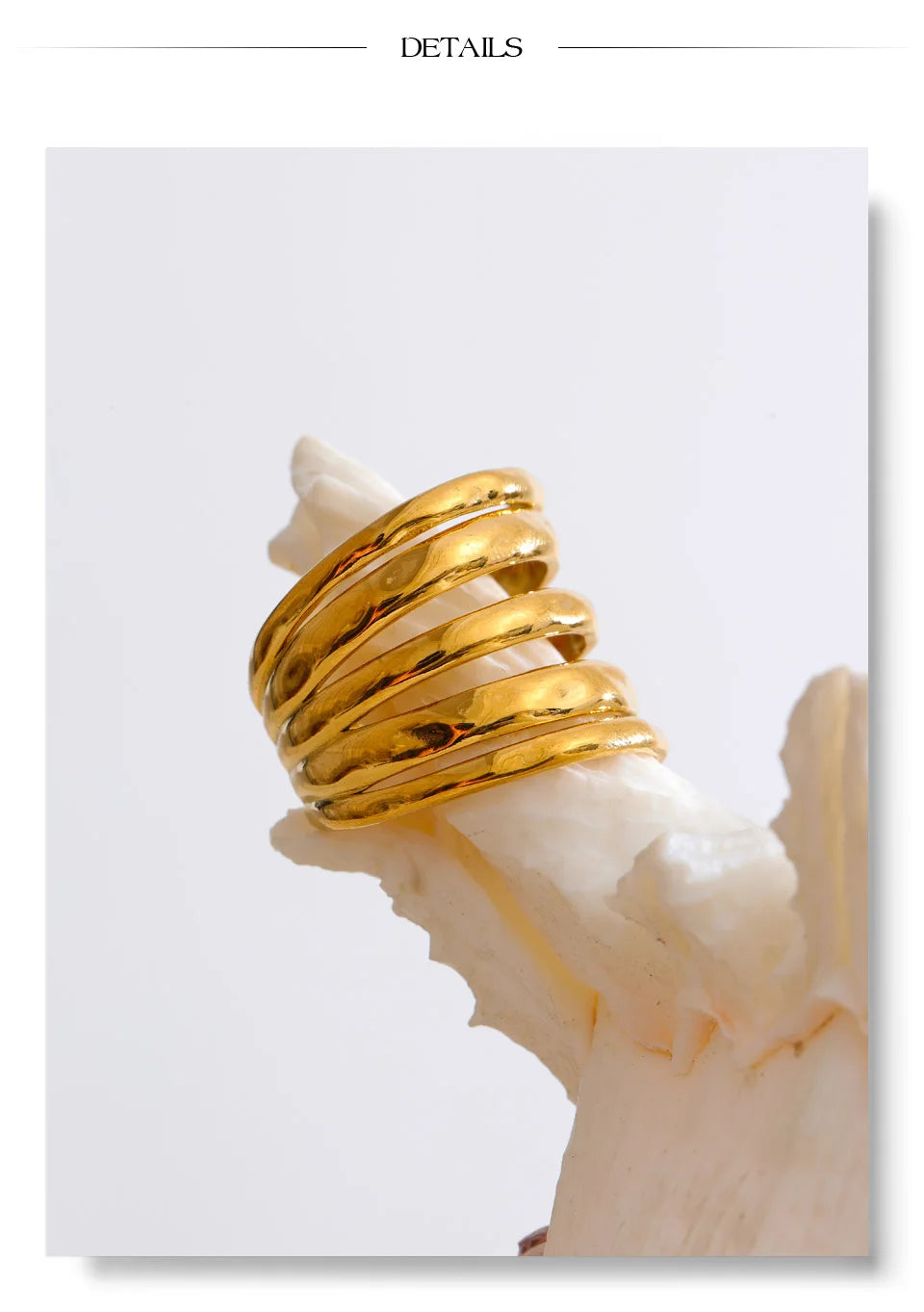 Geometric layered ring in 18K gold-plated stainless steel.