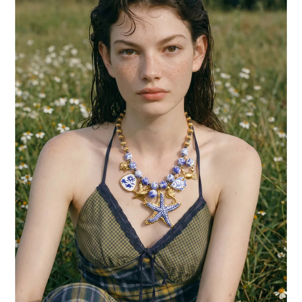 Star beaded geometric necklace in gold-plated stainless steel.
