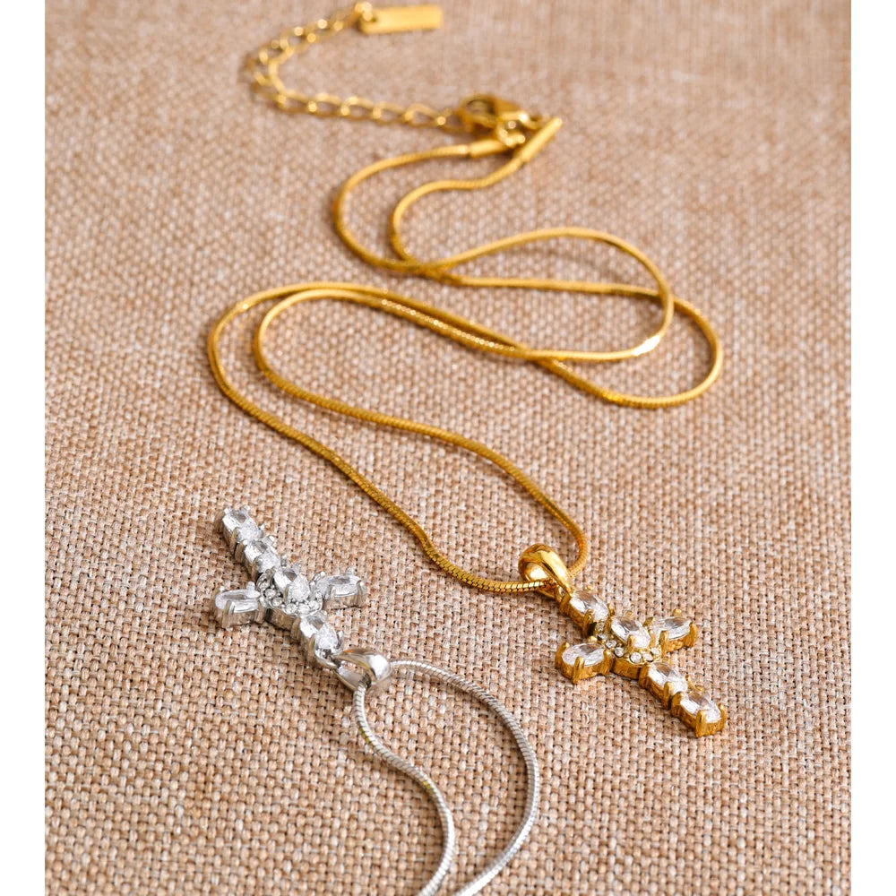 Cubic zirconia cross necklace in gold-plated stainless steel with cubic zirconia.