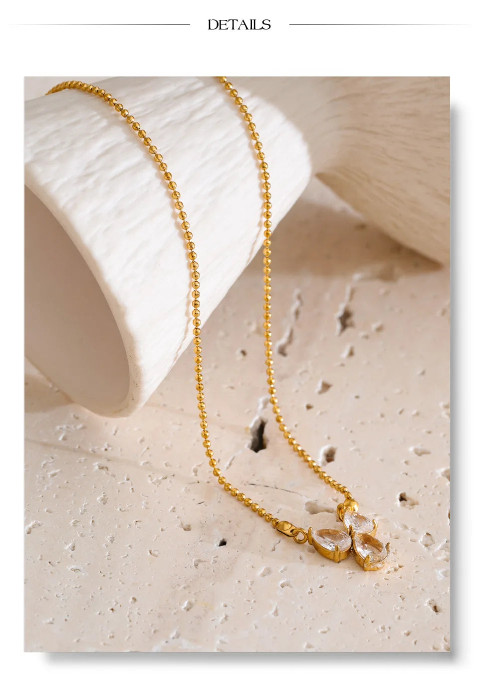 Cubic zirconia geometric necklace in gold-plated stainless steel with cubic zirconia.