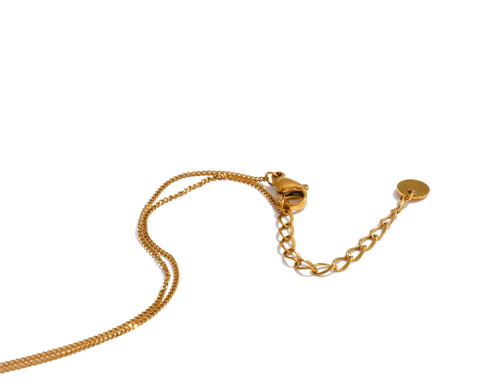 Cubic zirconia geometric necklace in gold-plated stainless steel with cubic zirconia.