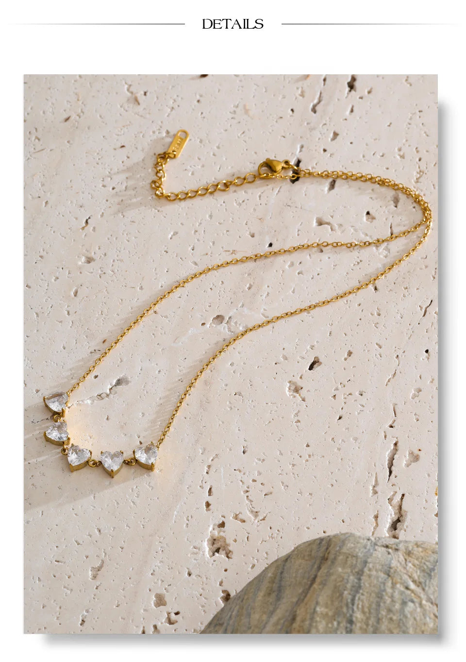 Cubic zirconia heart necklace in gold-plated stainless steel with cubic zirconia.