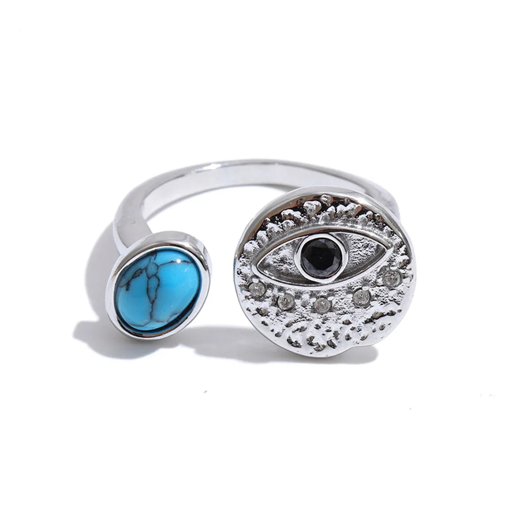 Cubic zirconia natural stone geometric ring in 18K gold-plated stainless steel with cubic zirconia and natural stone.