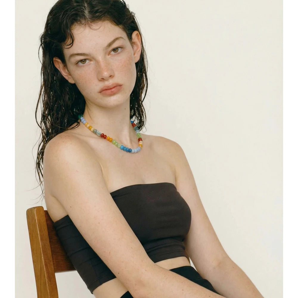 Natural stone beaded geometric necklace in gold-plated stainless steel with natural stone.
