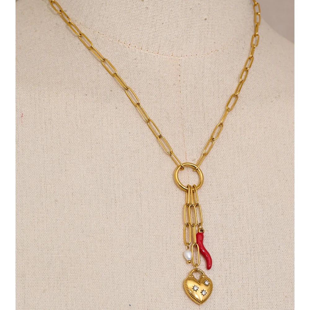 Cubic zirconia freshwater pearl heart necklace in gold-plated stainless steel with freshwater pearl and cubic zirconia.