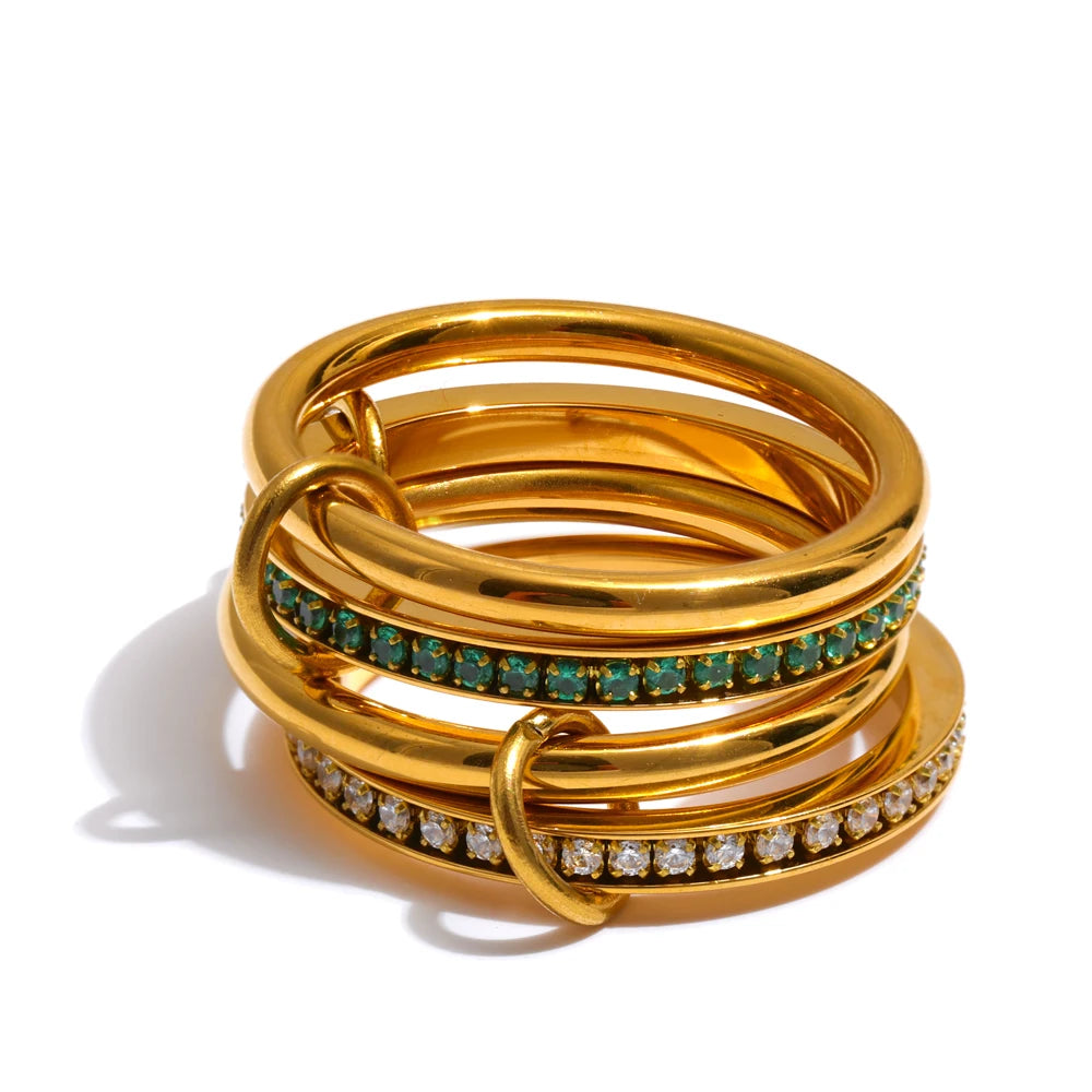 White cubic zirconia geometric ring in 18K gold-plated stainless steel with cubic zirconia.