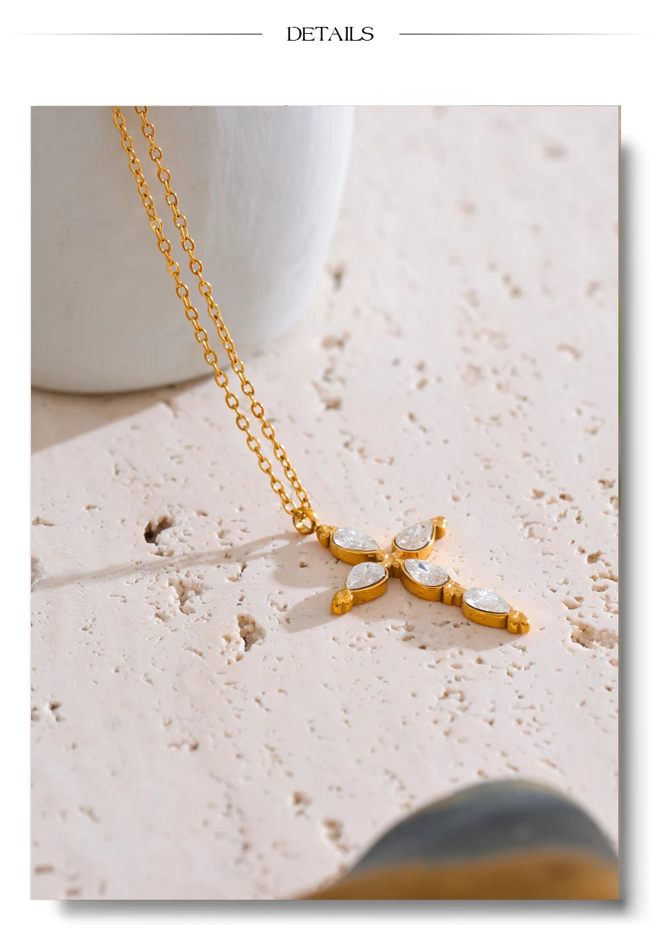 Cubic zirconia cross necklace in gold-plated stainless steel with cubic zirconia.