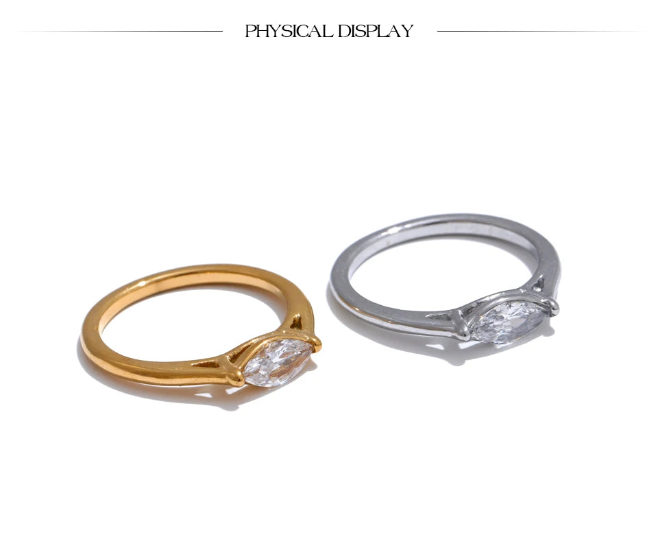 Cubic zirconia geometric ring in 18K gold-plated stainless steel with cubic zirconia.