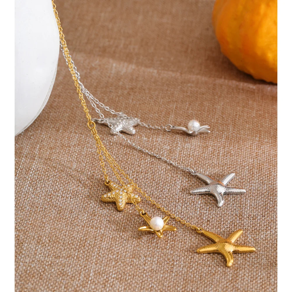 Cubic zirconia pearl shell necklace in gold-plated stainless steel with pearl and cubic zirconia.