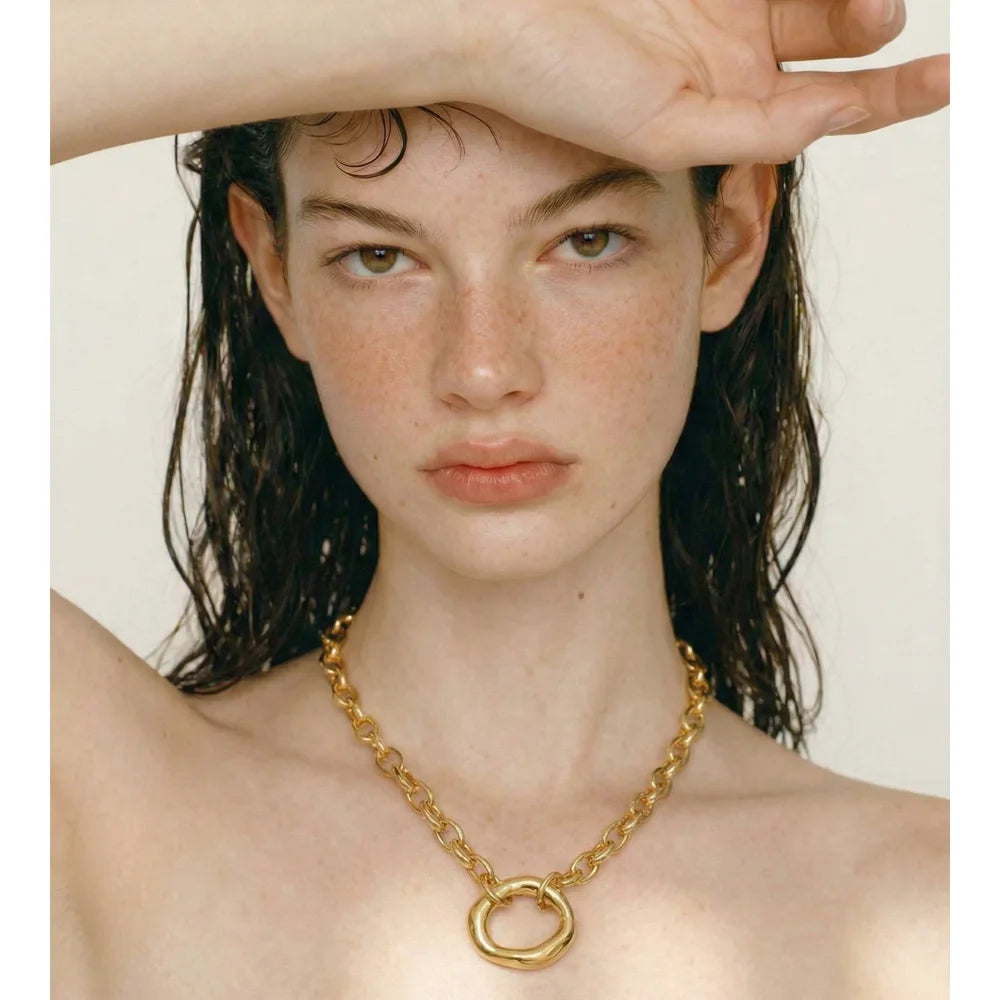 Coin geometric necklace in gold-plated stainless steel.