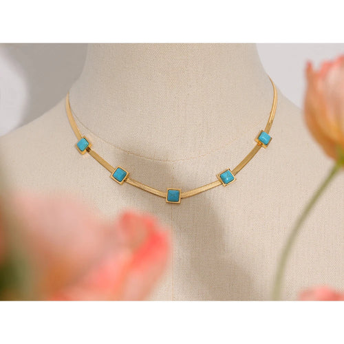 Blue natural stone snake necklace in gold-plated stainless steel with natural stone.