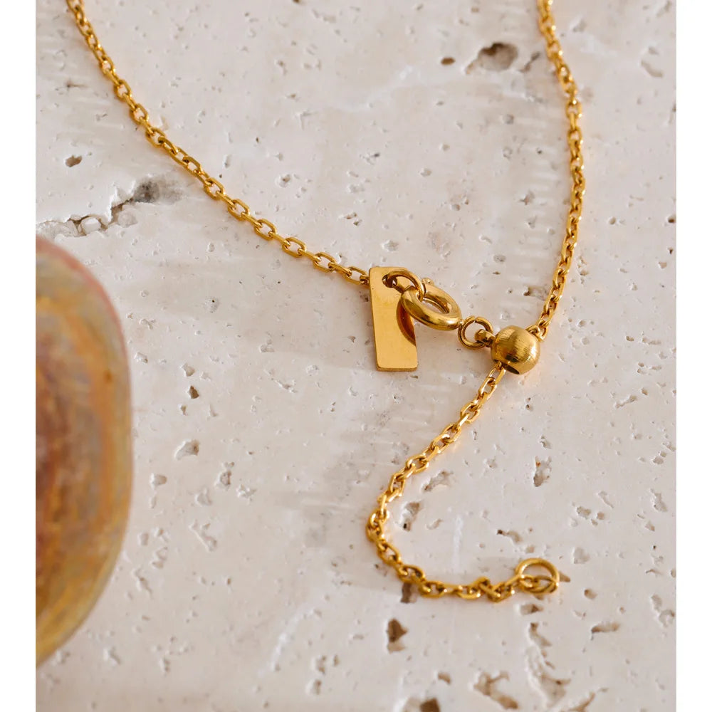 Cubic zirconia multi-color geometric necklace in gold-plated stainless steel with cubic zirconia.