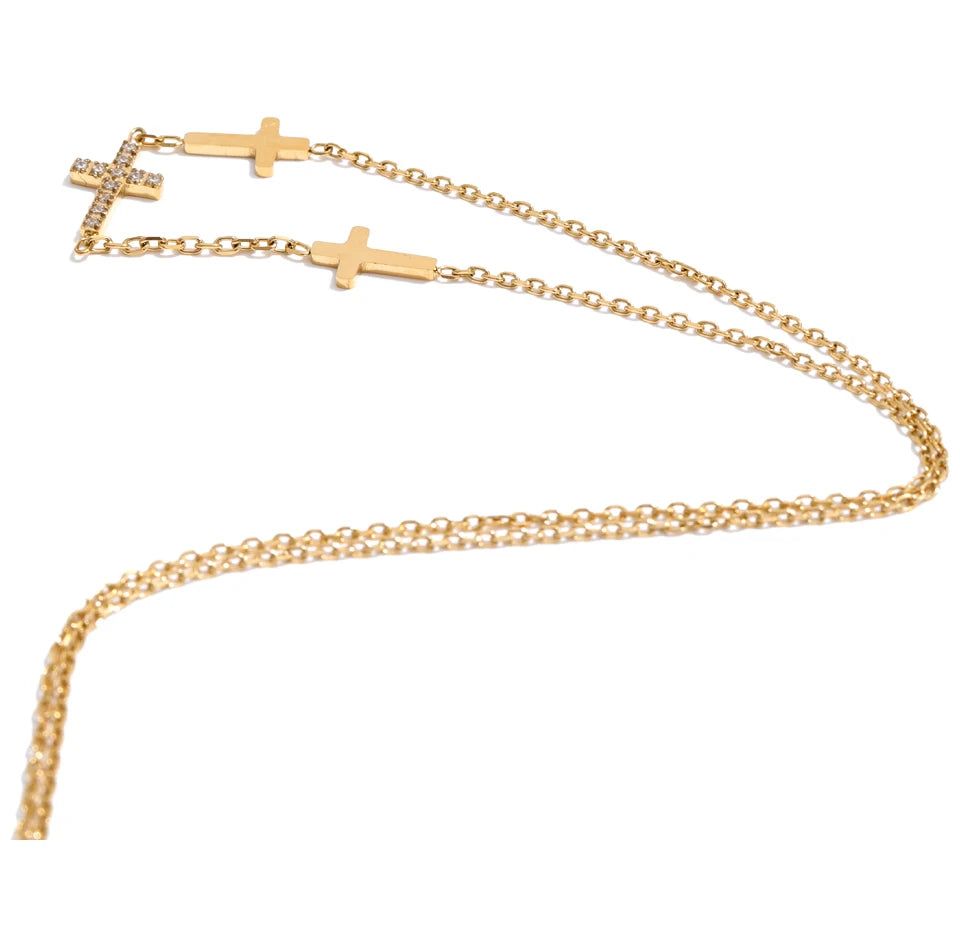 Cubic zirconia cross geometric necklace in gold-plated stainless steel with cubic zirconia.