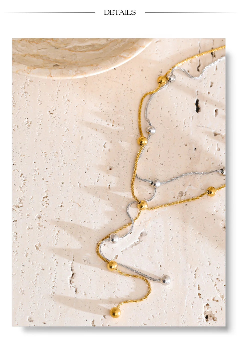 Beaded geometric chain necklace in gold-plated stainless steel.
