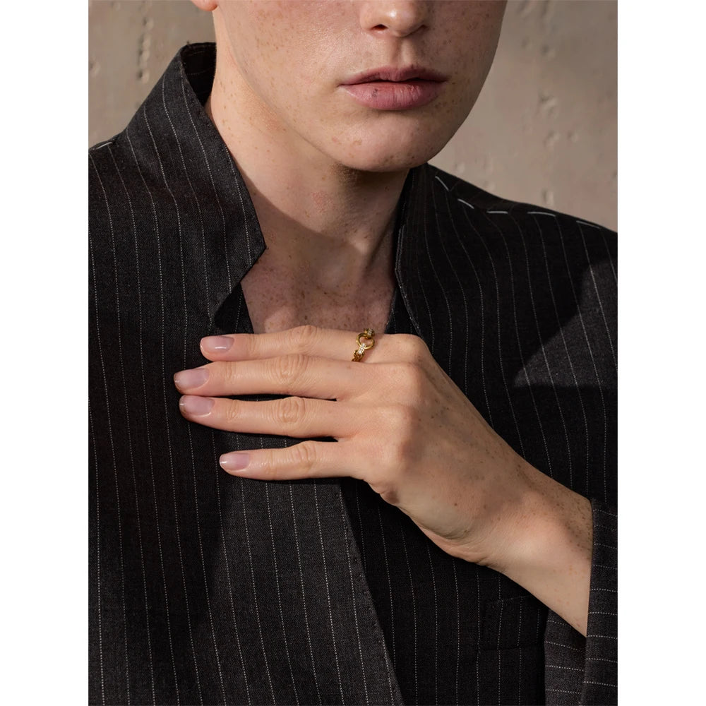 Cubic zirconia geometric ring in gold-plated stainless steel with cubic zirconia.