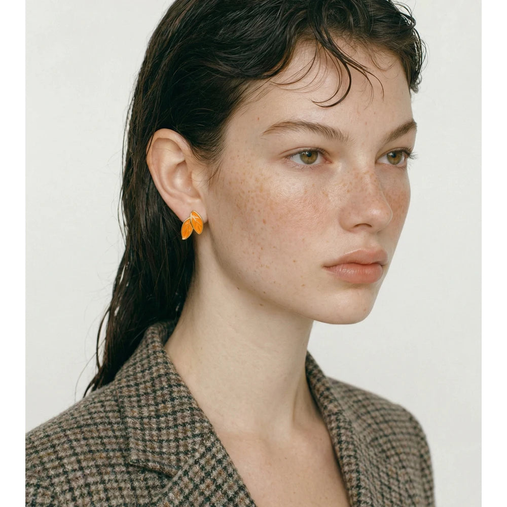 White enamel earrings in gold-plated stainless steel with enamel.