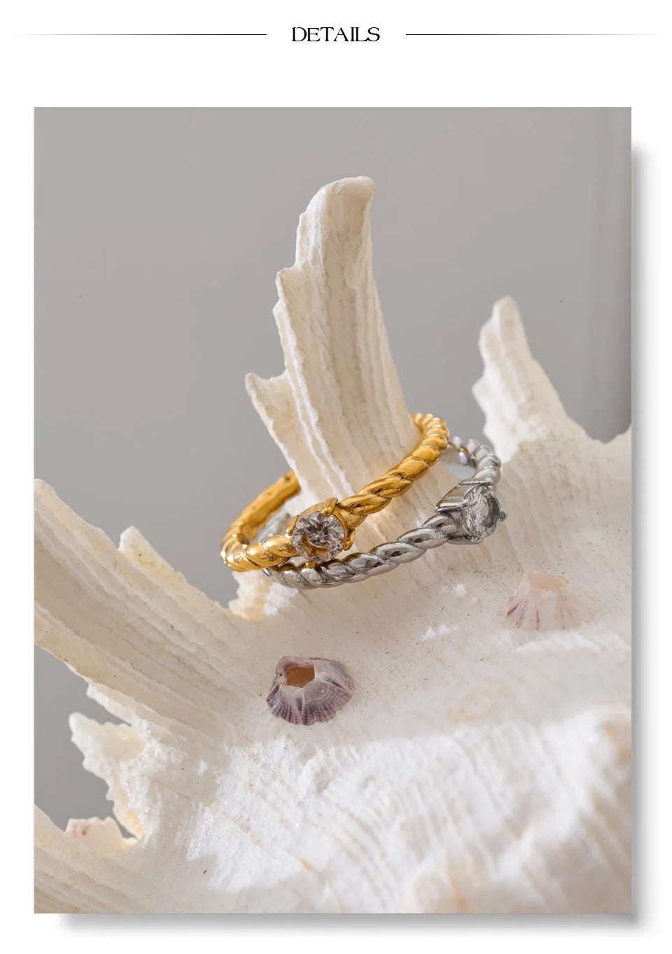 Cubic zirconia geometric ring in 18K gold-plated stainless steel with cubic zirconia.