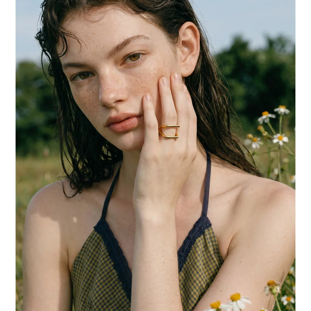 Geometric ring in 18K gold-plated stainless steel.
