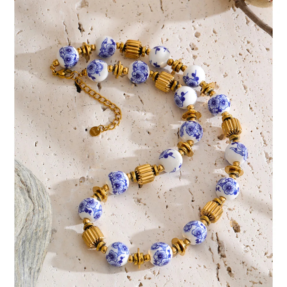 Blue flower beaded necklace in gold-plated stainless steel.